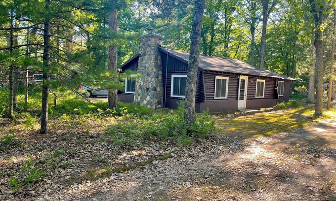 Rapid City Cottage | Experience Family FUN at Torch Lake Cabin with Beach Access