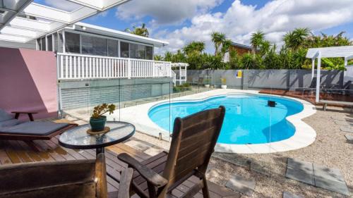 Banksia Beach House | Family Retreat with Pool & Guest House for Your Getaway