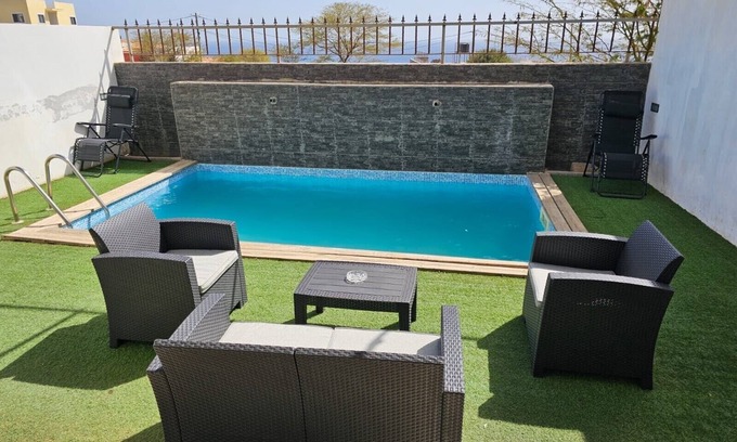 Praia Apartment | Family-Friendly Retreat with Pool and Ocean Views