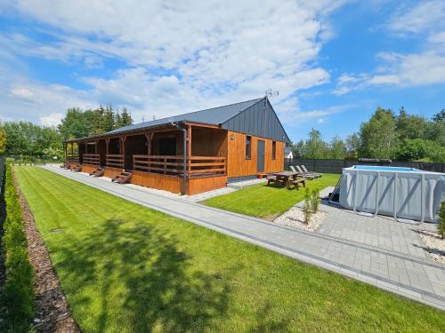 Powidz Apartment | Outstanding Family Resort Powidz with Private Beach & Pool