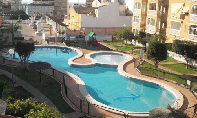 Coveta Fuma House | Ideal 4 Bedroom Townhouse Steps from the Beach with Pool