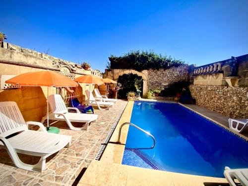 Xewkija House | Retro Farmhouse Escape with Pool and Oceanfront Views