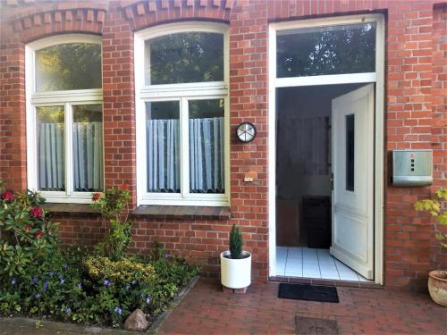 Delmenhorst Apartment | Ferienhäuschen Nordwolle - zentral, günstig, grün