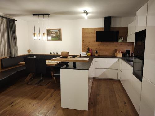 Matrei in Osttirol Apartment | Experience Breathtaking Mountain Views and Oceanfront Living