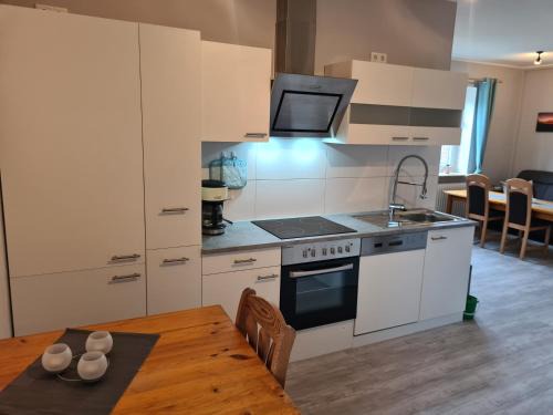 Nordleda Apartment | Cozy Ferienwohnung Sabrina: Poolside Retreat for Families
