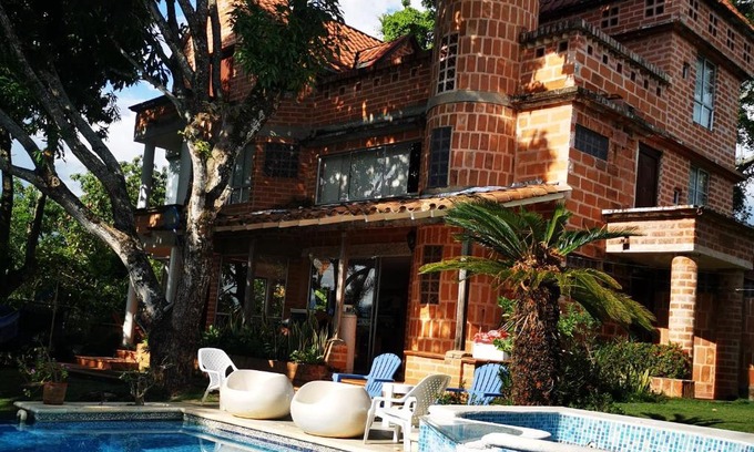 Sopetran House | Enchanting Castle-Shaped Retreat with Pool in Sopetrán