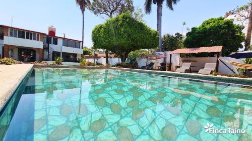 Jiutepec House | Finca Taino: Poolside Paradise with Oceanfront Views