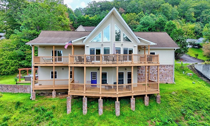 Hiawassee House | Fireside Vista by Chatuge Home Concierge Cozy mountain retreat with lake views, hot tub, game room, and private cinema lounge.