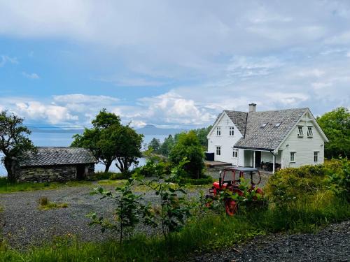 Etne House | Tranquil Fjord House with Private Bay and Boats Await