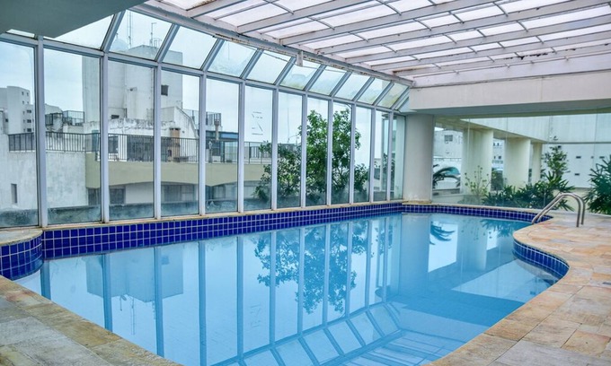 Morro do Maluf Apartment | Cozy Flat with Balcony near Pitangueiras Beach, Guarujá