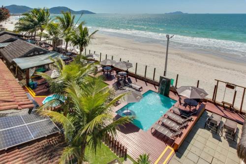 Ingleses Sul Apartment | Oceanfront Oasis at Flat Pietra: 4-Star Stay with Pool