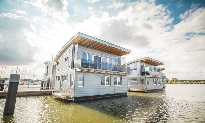 Kroeslin Boat Rental | Cozy Floating House Nr. 6 Idun with Ocean View & Spa
