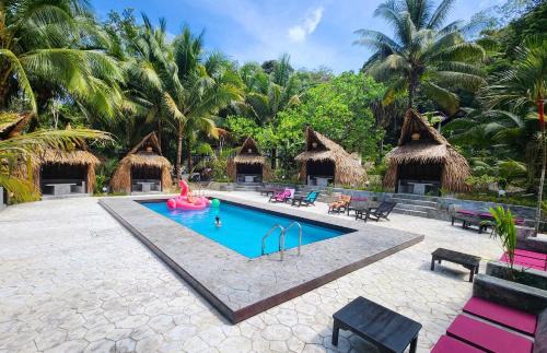 Ranong Resort | Relax at Flower Power Farm Village: Pool & Oceanfront Bliss