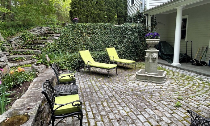 New Canaan House | Inviting Fountain Courtyard with Ocean View & Fireplace Kitchen