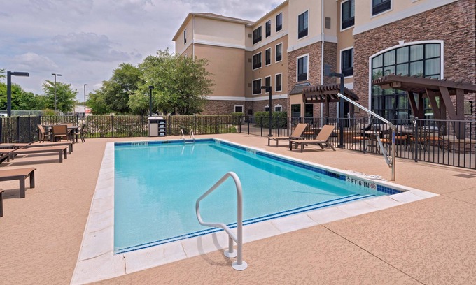McNeil Apartment | Indulge in Free Breakfast and Pool Access at Our Hotel!