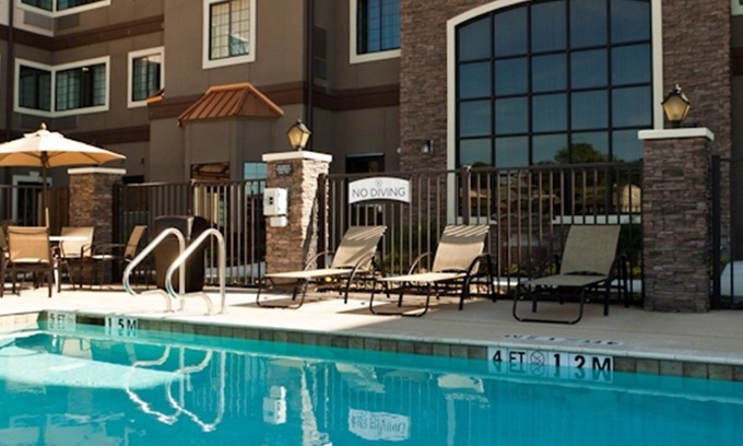 Spring Branch West Condo | Enjoy Free Breakfast and Relax by the Pool at Our Hotel