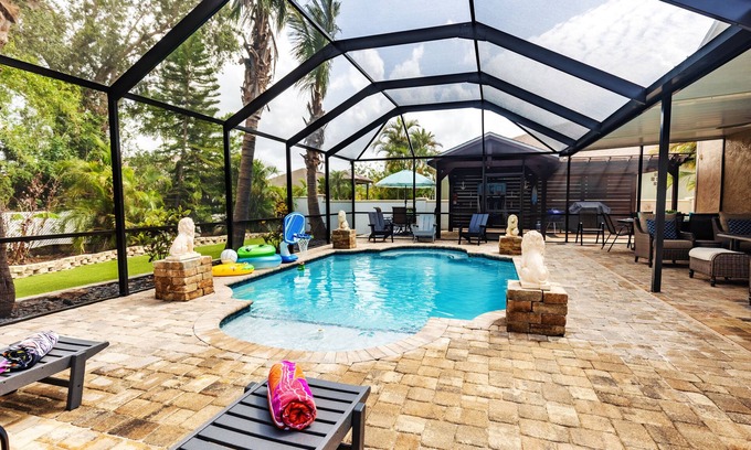 Golf and Sea Village of Apollo Beach House | Inviting Retreat with Heated Pool, Games & Ocean Views