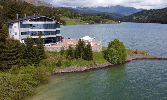 Colibita Villa | Exquisite French Villa on Scenic Lake Colibita Shore