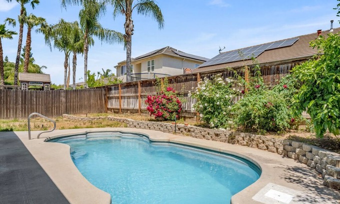 Fresno House | Fresno House: Poolside Retreat with BBQ & Firepit Amenities