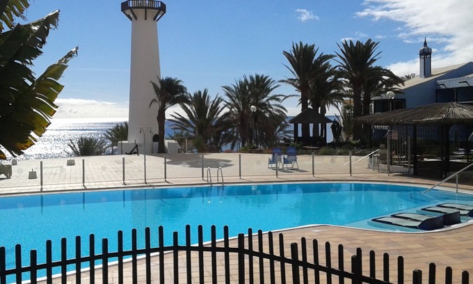 Playa del Aguila Apartment | Beautiful Frontline Retreat with Garden & Ocean View