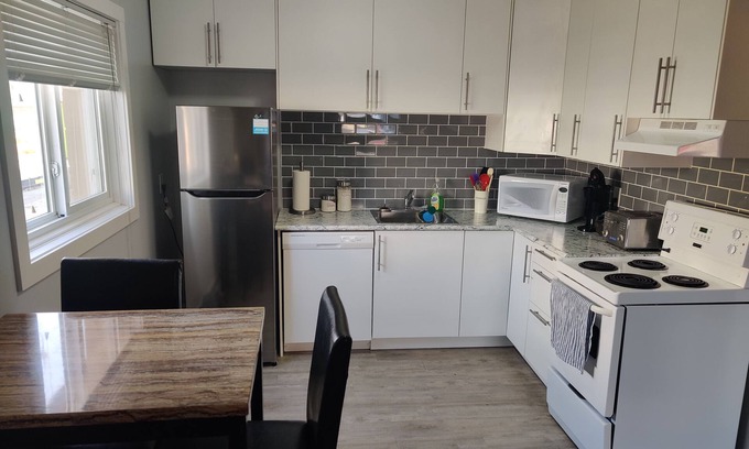 Regina Apartment | Modern 1 Bedroom Retreat with Dedicated Parking & Breakfast