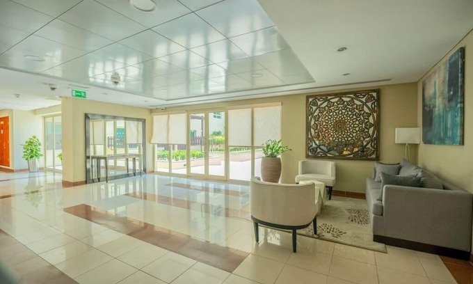 The Greens Apartment | Modern Stay with Large Terrace & Sofa Bed for Your Comfort