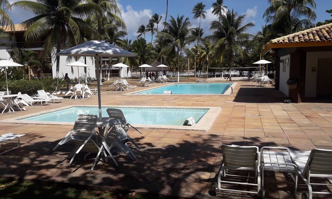 Sao Domingos Apartment | Beachside Furnished Flat with Pool & Ocean Views in Ilhéus