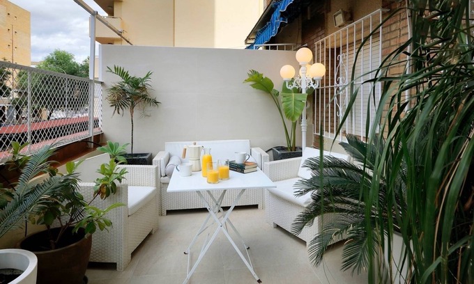 Giralda Sur Apartment | Cozy Garden Apartment Steps from the City Center
