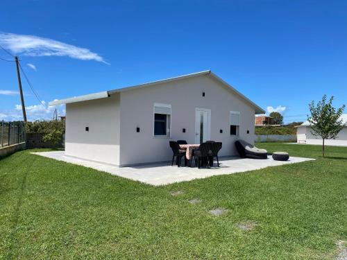 Qerek House | Beachfront Getaway: Family-Friendly Garden Beach House