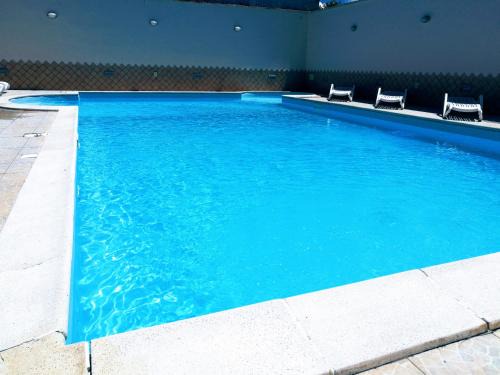 Capua House | Cozy Garden Inn with Pool and Oceanfront Views