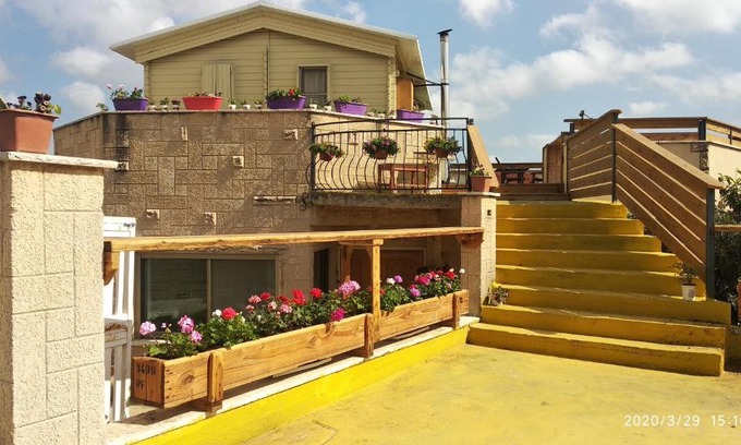 Shlomi Ski Chalet | Experience Garden on TOP of the WORLD: 4-Star Ocean View Retreat