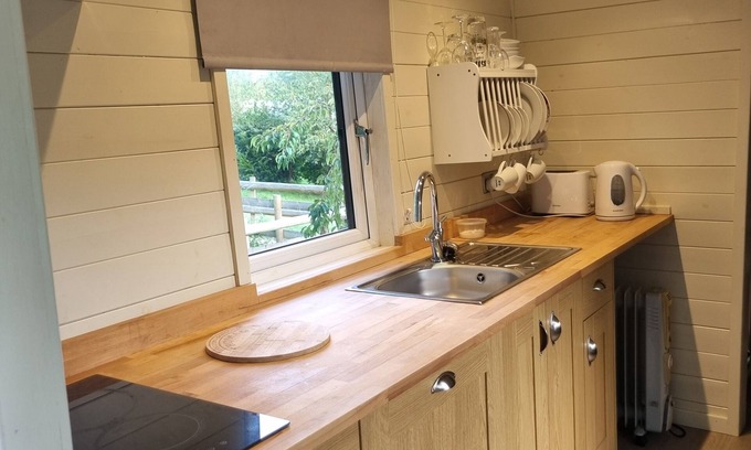 Llanfair Caereinion Ski Chalet | Relaxing Glamping Hut with River Views and Spa Amenities