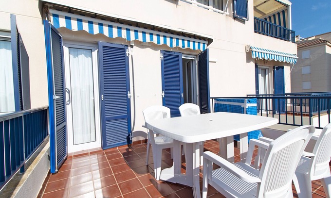 Canet de Berenguer Apartment | Global Properties: Coastal Retreat with Terrace and Ocean Views