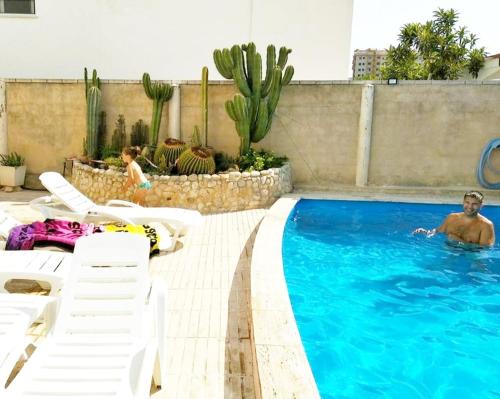 Playa de Gandia House | Golden Tower Pensión: Oceanfront Getaway with Pool Access