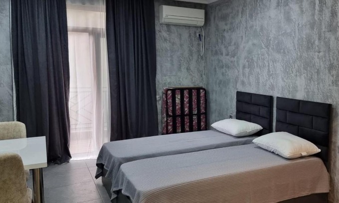 T'ba Apartment | Cozy Gonio: Family-Friendly Stay with Pool Access