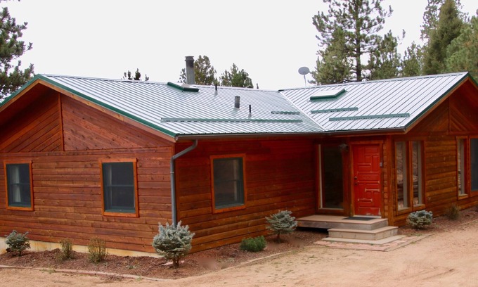 Divide House | Scenic Deck with Pike's Peak Views in Serene Forest Getaway