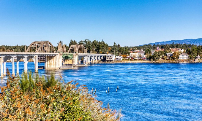 Florence Condo | Elegant Riverfront Retreat with Breathtaking Views and Deck