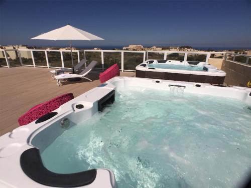 Qala Apartment | Oceanfront GozoWindmill Apartments with Hot Tub & Breakfast