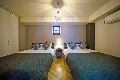 Minamisenba Apartment | Discover Gracia Hotel: Family-Friendly Comfort Awaits