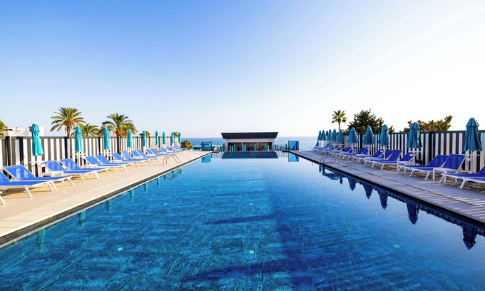 Avsallar Hotel | Exquisite Granada Red: Indulge in Poolside Relaxation