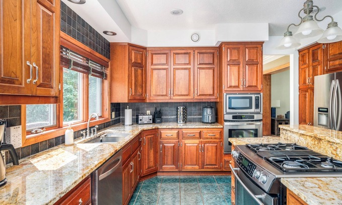 Grand Rapids Cabin | Premier Grand Rapids Retreat with Private Boat Dock & Spa
