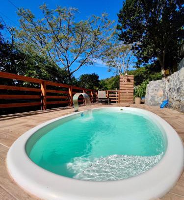 Palhoca House | Gray House: Poolside Retreat Steps from the Ocean