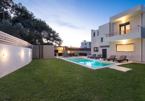 Asgourou Villa | Tranquil Green Horizon Villa with Oceanfront Pool Access