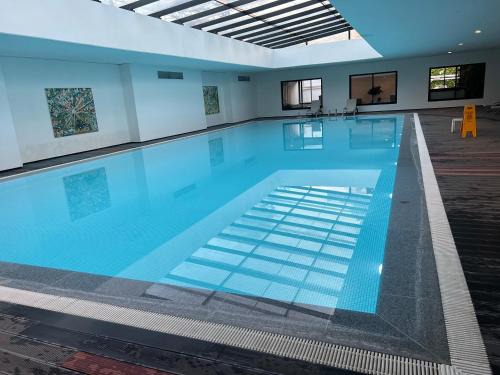 Cantegril Apartment | Indulgent Green Life: Poolside Escape with Ocean Views