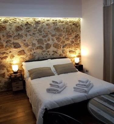 Castelforte Apartment | Exquisite Green Oasis Gabella Monolocale with Oceanfront Views