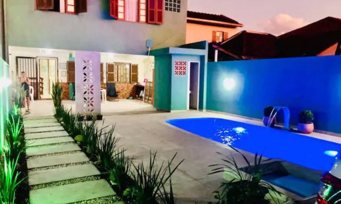 Guaratuba House | Relax at GreenHouse: Steps from the Beach & Family-Friendly