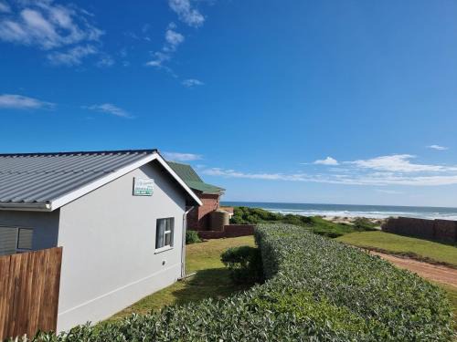 Oyster Bay House | Oceanfront Retreat at Groenhuisie with Top-Rated Amenities