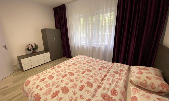Buzau Apartment | Guest Rated 10/10: Grove Apartment with Hot Tub & Kids' Amenities