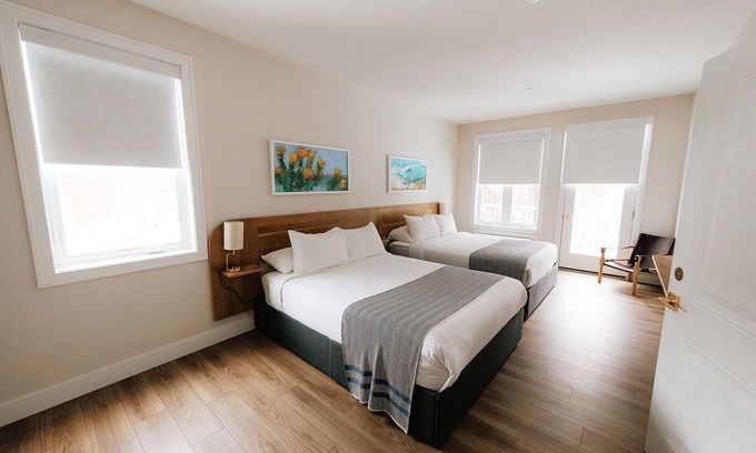 Elk Rapids Apartment | Elegant Guest Room with King Bed and Lake View