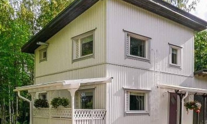 Rautalampi House | Relax at Halmesaari by Interhome with Spa and Lake Views